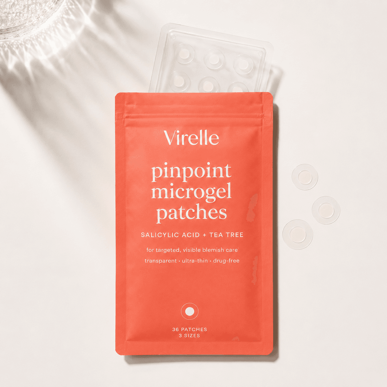 Virelle microgel patches pouch flat-lay with the patch tray and loose patches