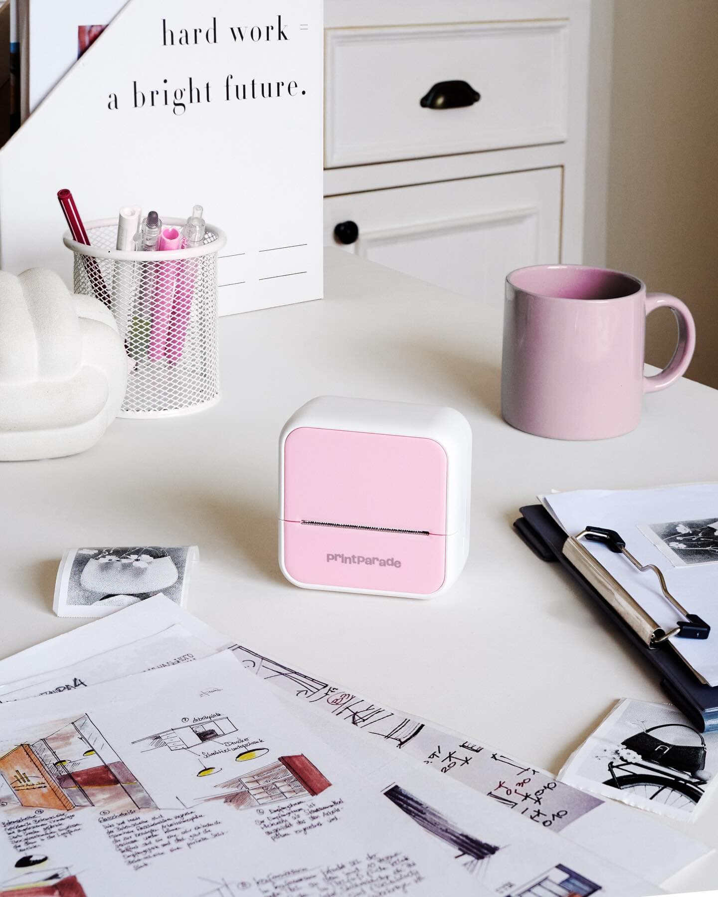 printParade thermal printer on a pink desk, styled product shot