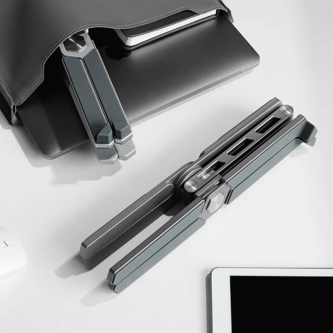 Desk Labs laptop stand folded flat, grey finish product shot