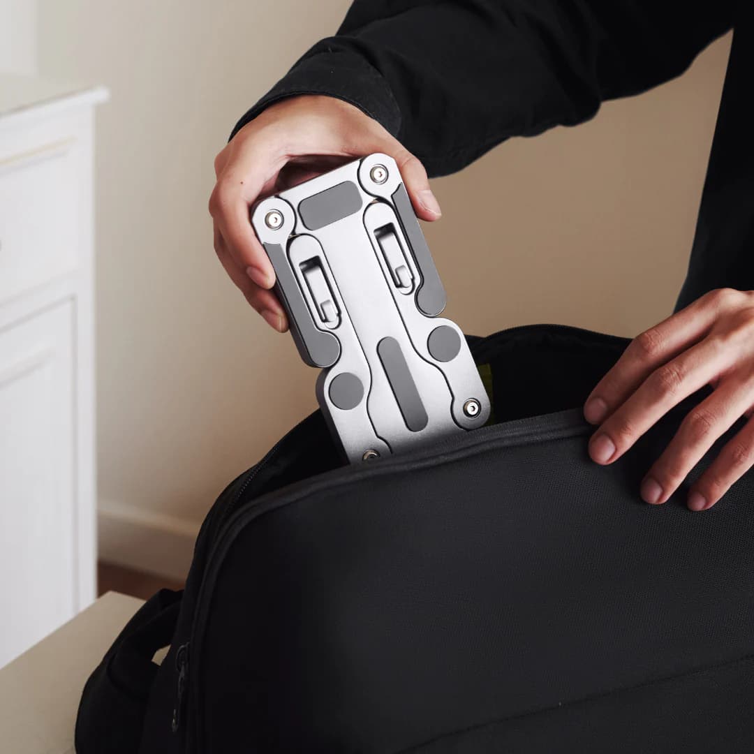 Desk Labs foldable stand packed flat, showing portability